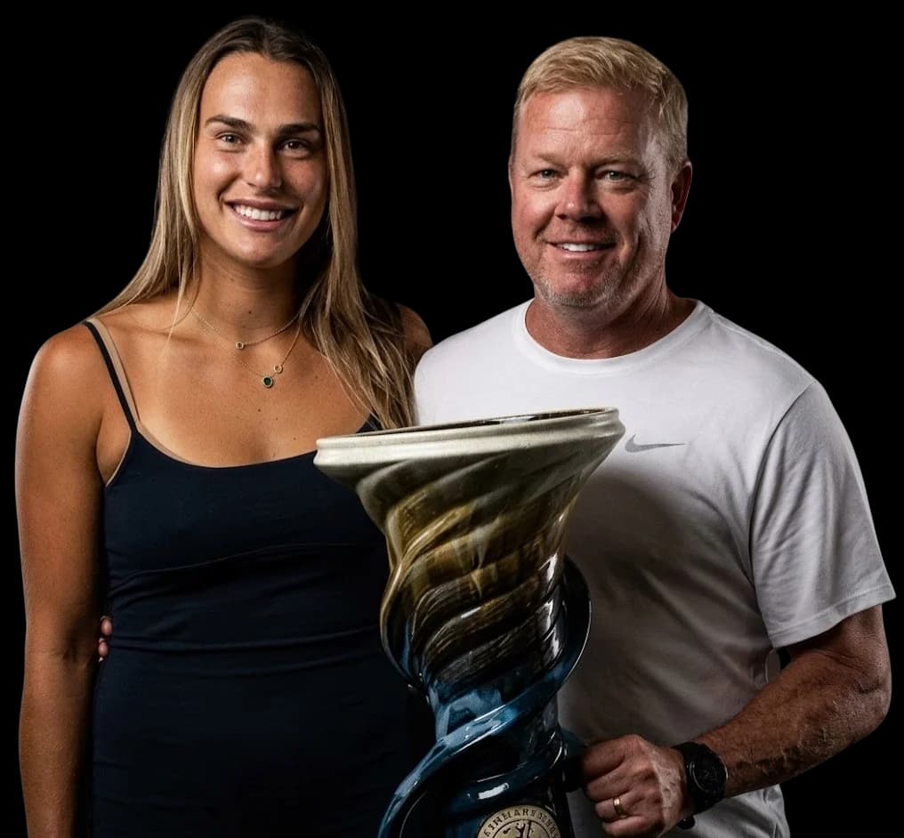 Gavin Macmillan with Aryna Sabalenka holding trophy